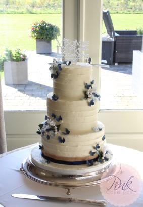 buttercream-wedding-cake-navy-butterflies-peak-edge